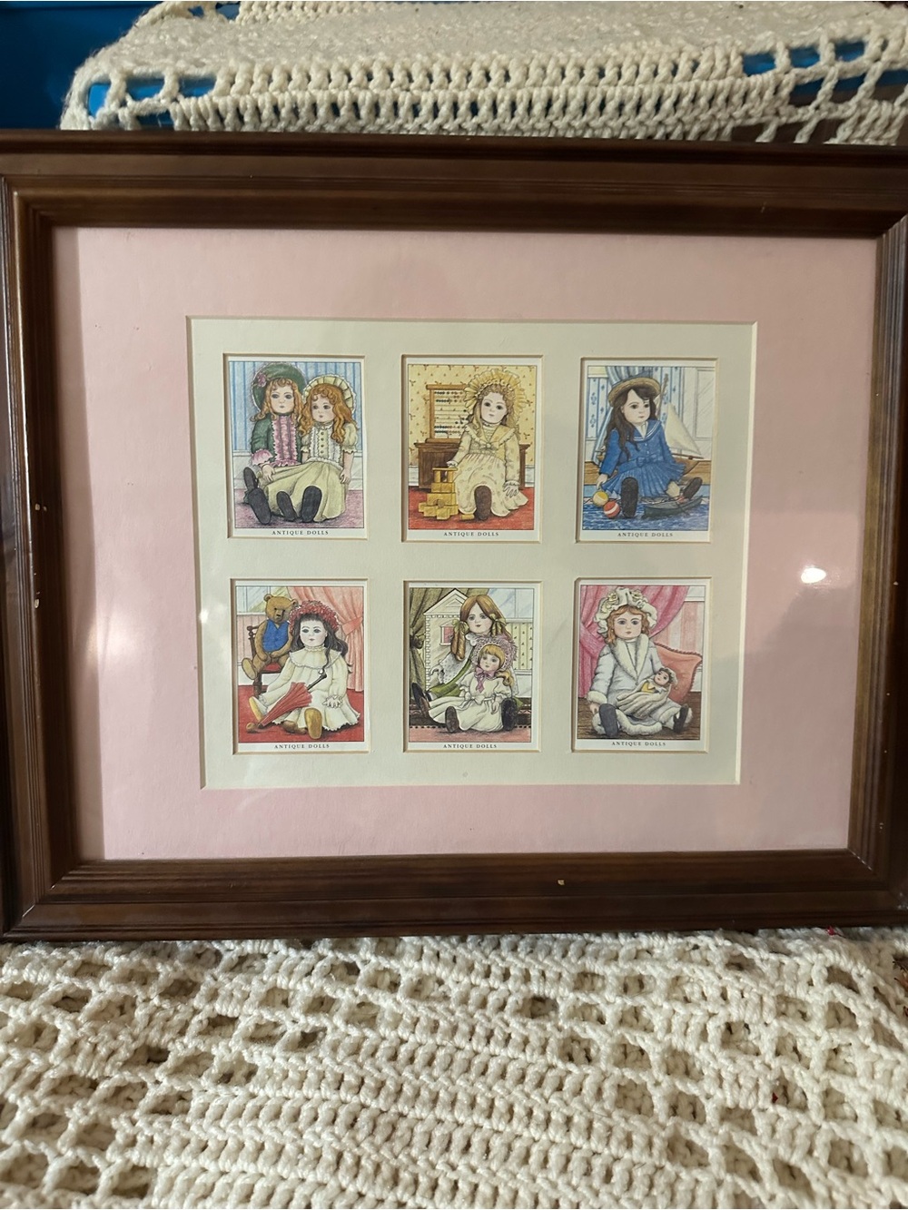Framed Doll Print Collage with Pink Mat and Brown Frame